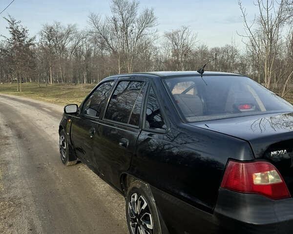 Чорний Деу Нексія, об'ємом двигуна 1.5 л та пробігом 141 тис. км за 2500 $, фото 4 на Automoto.ua