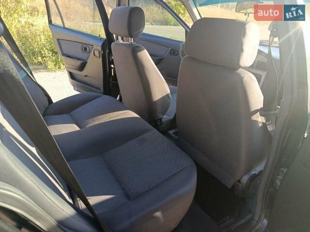 Черный Дэу Нексия, объемом двигателя 1.6 л и пробегом 122 тыс. км за 2400 $, фото 5 на Automoto.ua