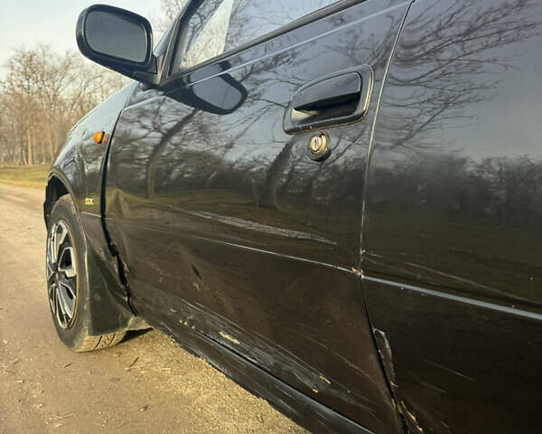Чорний Деу Нексія, об'ємом двигуна 1.5 л та пробігом 141 тис. км за 2500 $, фото 5 на Automoto.ua