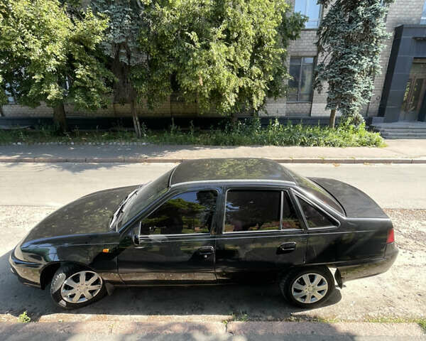 Черный Дэу Нексия, объемом двигателя 1.5 л и пробегом 178 тыс. км за 2350 $, фото 2 на Automoto.ua