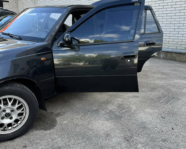 Черный Дэу Нексия, объемом двигателя 1.5 л и пробегом 192 тыс. км за 2700 $, фото 4 на Automoto.ua