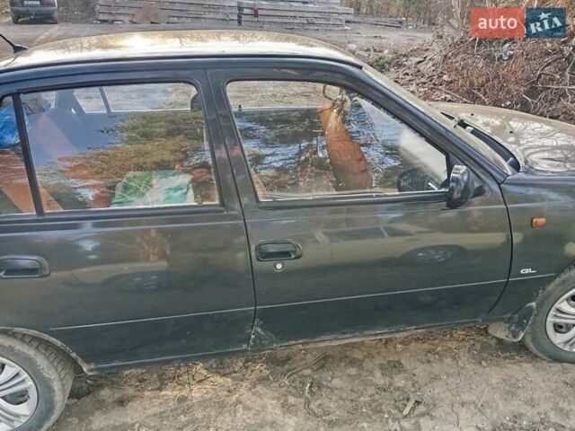 Чорний Деу Нексія, об'ємом двигуна 1.5 л та пробігом 240 тис. км за 950 $, фото 3 на Automoto.ua