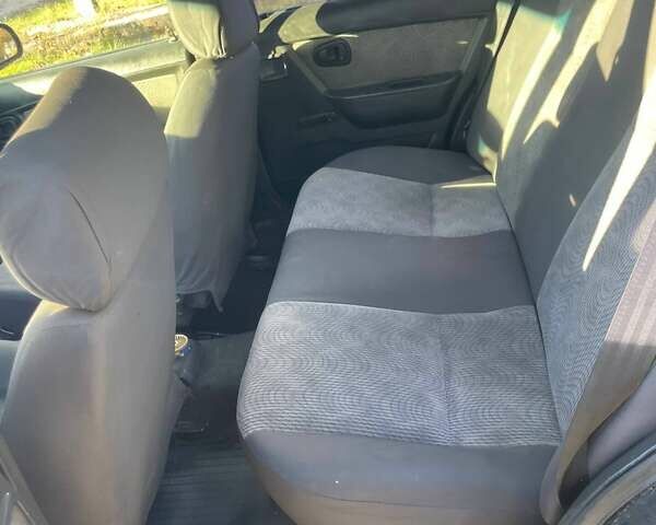 Деу Нексія 2011 у Змиеве на Automoto.ua Чорний Деу Нексія, об'ємом двигуна 1.5 л та пробігом 248 тис. км за 1100 $, фото 6 на Automoto.ua