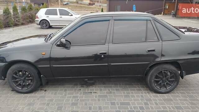 Чорний Деу Нексія, об'ємом двигуна 1.5 л та пробігом 160 тис. км за 3300 $, фото 3 на Automoto.ua