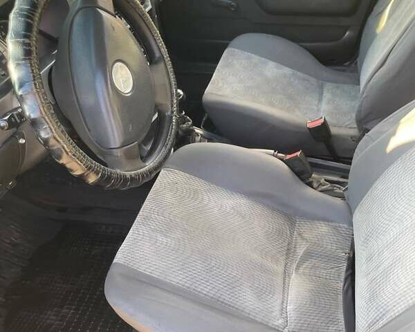 Деу Нексія 2011 у Змиеве на Automoto.ua Чорний Деу Нексія, об'ємом двигуна 1.5 л та пробігом 248 тис. км за 1100 $, фото 7 на Automoto.ua