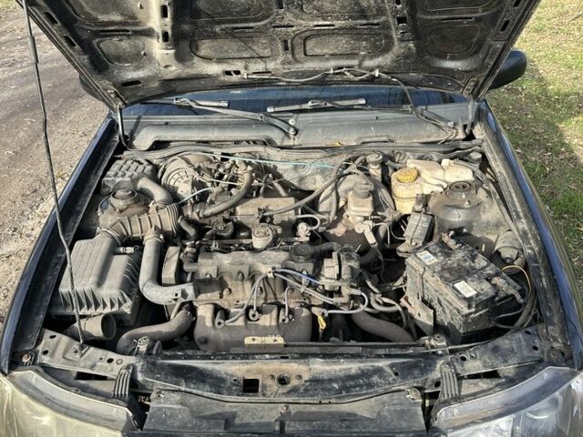 Чорний Деу Нексія, об'ємом двигуна 1.5 л та пробігом 231 тис. км за 1500 $, фото 5 на Automoto.ua