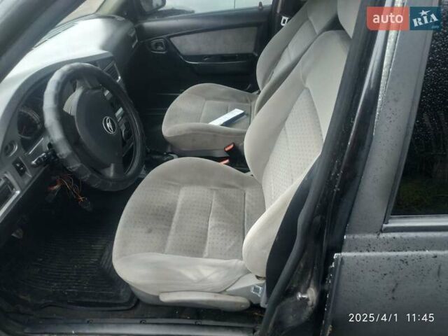 Черный Дэу Нексия, объемом двигателя 1.6 л и пробегом 236 тыс. км за 850 $, фото 4 на Automoto.ua