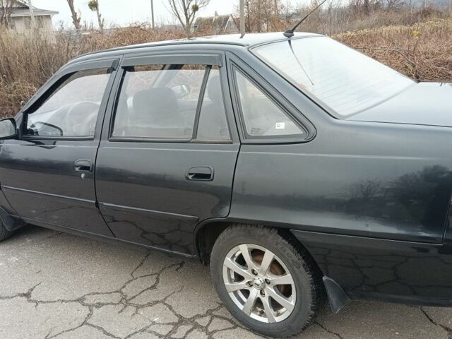 Черный Дэу Нексия, объемом двигателя 1 л и пробегом 66 тыс. км за 3500 $, фото 2 на Automoto.ua