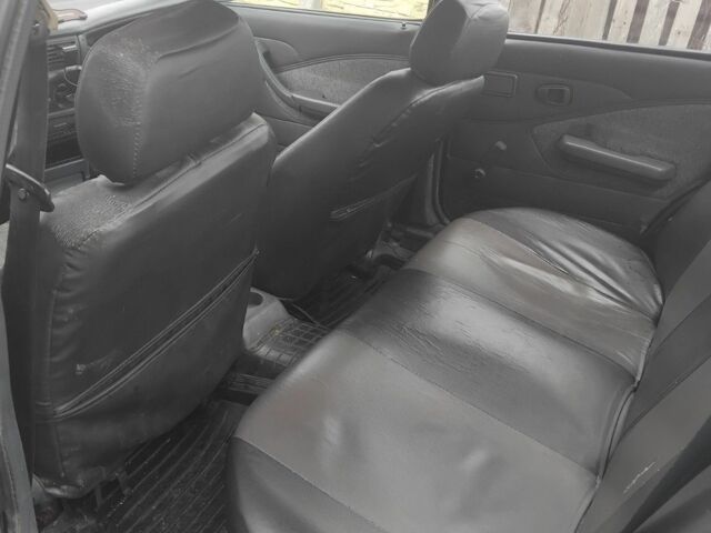 Червоний Деу Нексія, об'ємом двигуна 1.3 л та пробігом 250 тис. км за 832 $, фото 4 на Automoto.ua