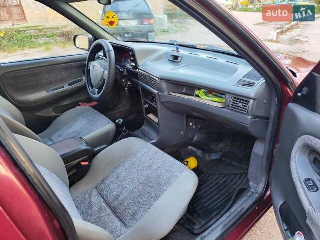 Червоний Деу Нексія, об'ємом двигуна 1.5 л та пробігом 182 тис. км за 1390 $, фото 7 на Automoto.ua