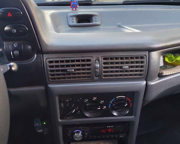 Червоний Деу Нексія, об'ємом двигуна 1.5 л та пробігом 182 тис. км за 1390 $, фото 12 на Automoto.ua