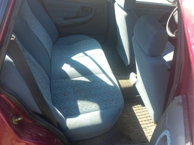 Червоний Деу Нексія, об'ємом двигуна 1.5 л та пробігом 155 тис. км за 1000 $, фото 5 на Automoto.ua