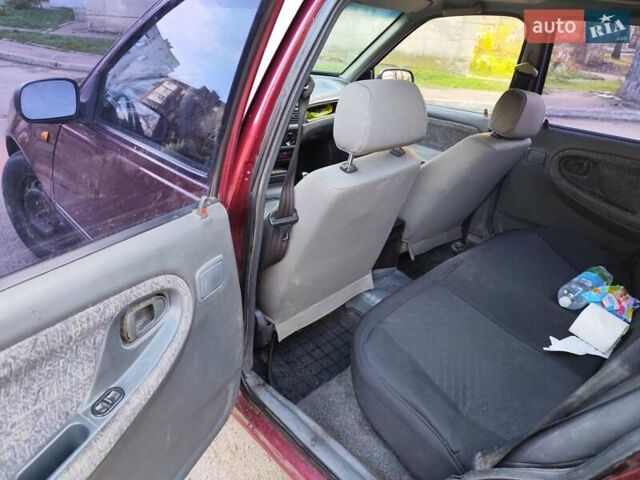 Червоний Деу Нексія, об'ємом двигуна 1.5 л та пробігом 182 тис. км за 1390 $, фото 11 на Automoto.ua