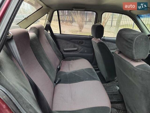 Червоний Деу Нексія, об'ємом двигуна 1.5 л та пробігом 137 тис. км за 900 $, фото 15 на Automoto.ua