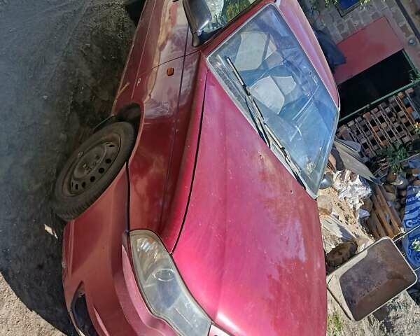 Червоний Деу Нексія, об'ємом двигуна 1.6 л та пробігом 319 тис. км за 1250 $, фото 5 на Automoto.ua