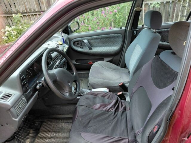 Червоний Деу Нексія, об'ємом двигуна 1.5 л та пробігом 176 тис. км за 1500 $, фото 5 на Automoto.ua