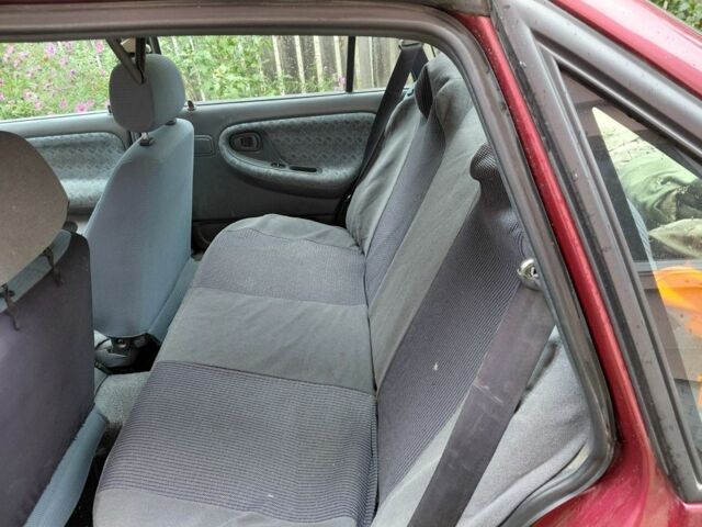 Червоний Деу Нексія, об'ємом двигуна 1.5 л та пробігом 176 тис. км за 1500 $, фото 6 на Automoto.ua