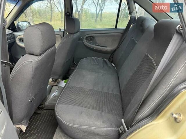 Жовтий Деу Нексія, об'ємом двигуна 1.6 л та пробігом 286 тис. км за 1850 $, фото 7 на Automoto.ua