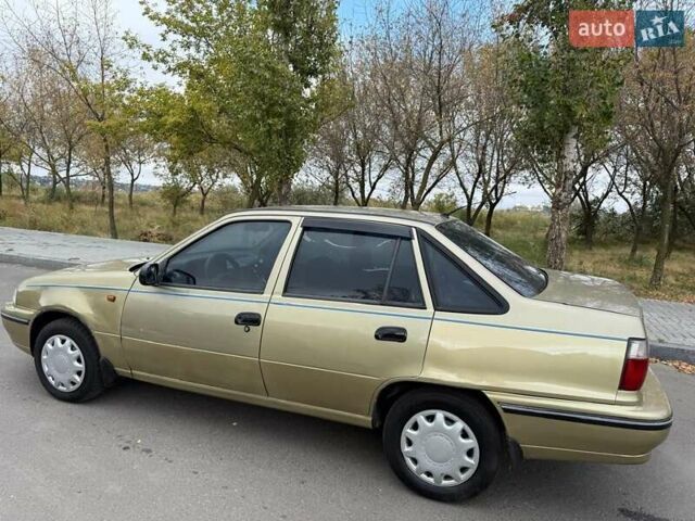 Жовтий Деу Нексія, об'ємом двигуна 1.6 л та пробігом 286 тис. км за 1850 $, фото 12 на Automoto.ua