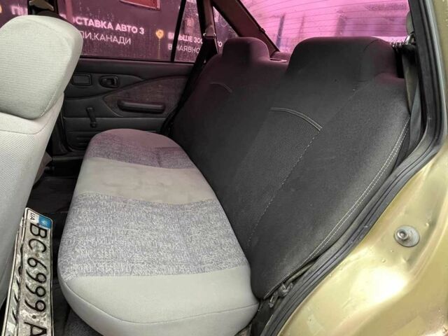 Жовтий Деу Нексія, об'ємом двигуна 1.5 л та пробігом 450 тис. км за 1500 $, фото 13 на Automoto.ua