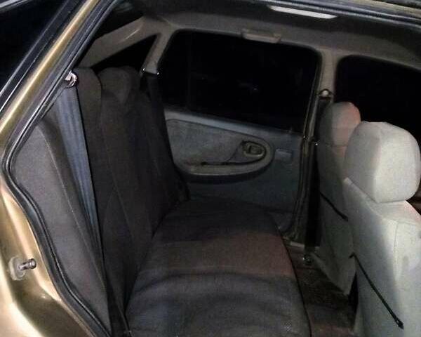 Жовтий Деу Нексія, об'ємом двигуна 1.5 л та пробігом 185 тис. км за 2000 $, фото 10 на Automoto.ua