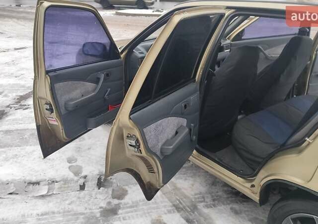 Жовтий Деу Нексія, об'ємом двигуна 1.6 л та пробігом 360 тис. км за 2000 $, фото 8 на Automoto.ua