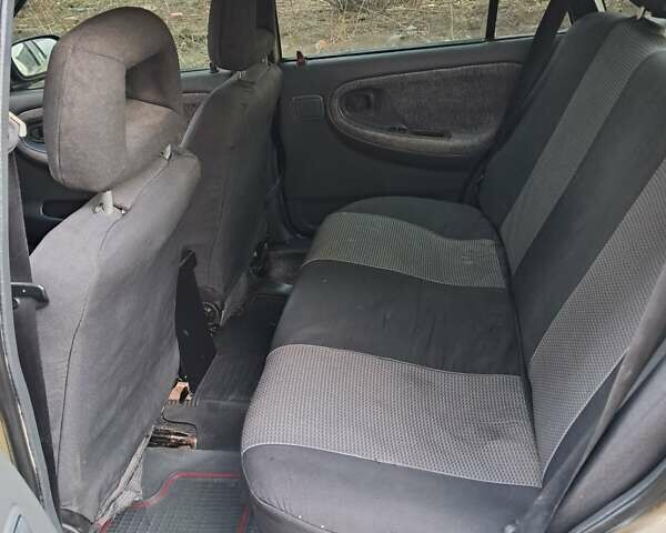 Жовтий Деу Нексія, об'ємом двигуна 1.5 л та пробігом 205 тис. км за 1399 $, фото 22 на Automoto.ua