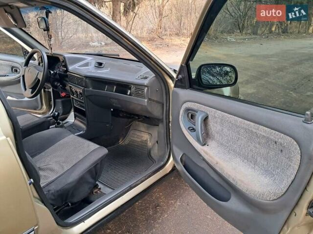 Жовтий Деу Нексія, об'ємом двигуна 1.5 л та пробігом 205 тис. км за 1399 $, фото 26 на Automoto.ua