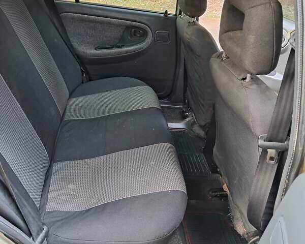 Жовтий Деу Нексія, об'ємом двигуна 1.5 л та пробігом 205 тис. км за 1399 $, фото 25 на Automoto.ua