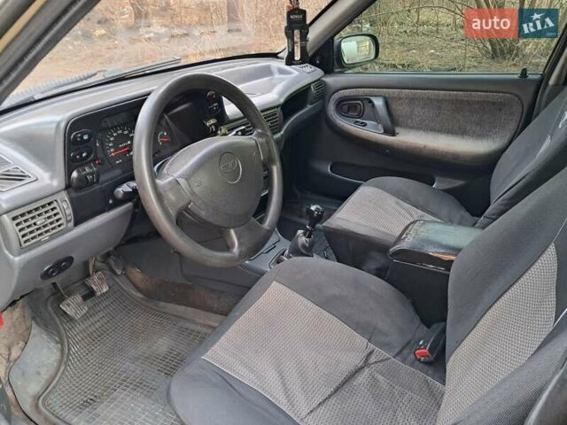 Жовтий Деу Нексія, об'ємом двигуна 1.5 л та пробігом 205 тис. км за 1399 $, фото 20 на Automoto.ua