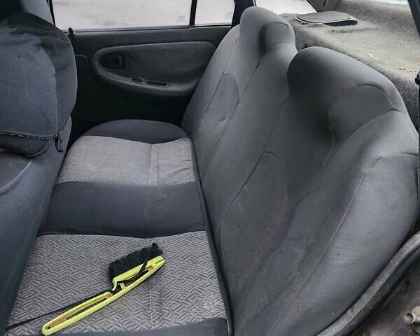 Сірий Деу Нексія, об'ємом двигуна 1.5 л та пробігом 300 тис. км за 450 $, фото 5 на Automoto.ua