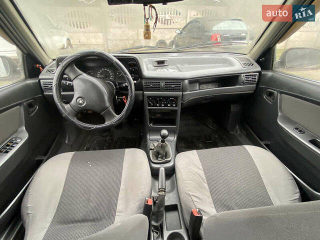 Серый Дэу Нексия, объемом двигателя 1.5 л и пробегом 160 тыс. км за 1500 $, фото 2 на Automoto.ua