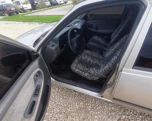 Сірий Деу Нексія, об'ємом двигуна 1.5 л та пробігом 250 тис. км за 1299 $, фото 8 на Automoto.ua