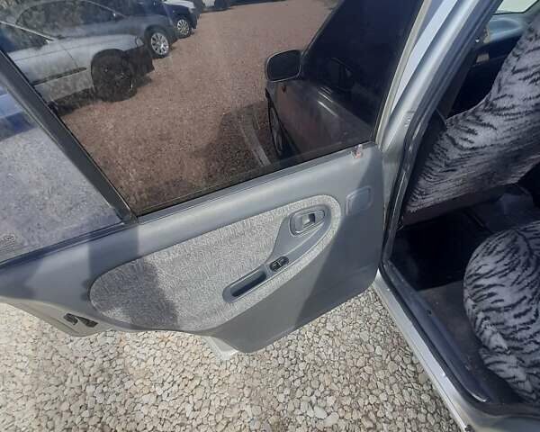 Сірий Деу Нексія, об'ємом двигуна 1.5 л та пробігом 250 тис. км за 1299 $, фото 6 на Automoto.ua