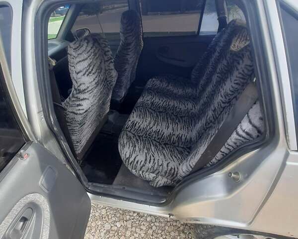 Сірий Деу Нексія, об'ємом двигуна 1.5 л та пробігом 250 тис. км за 1190 $, фото 5 на Automoto.ua