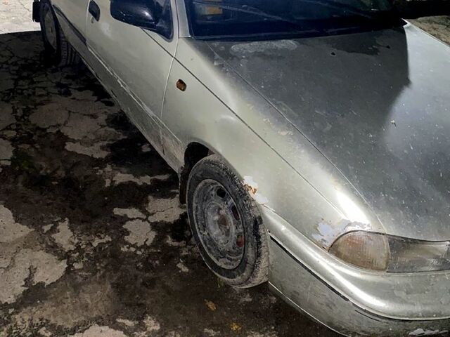 Сірий Деу Нексія, об'ємом двигуна 1.5 л та пробігом 350 тис. км за 1000 $, фото 3 на Automoto.ua
