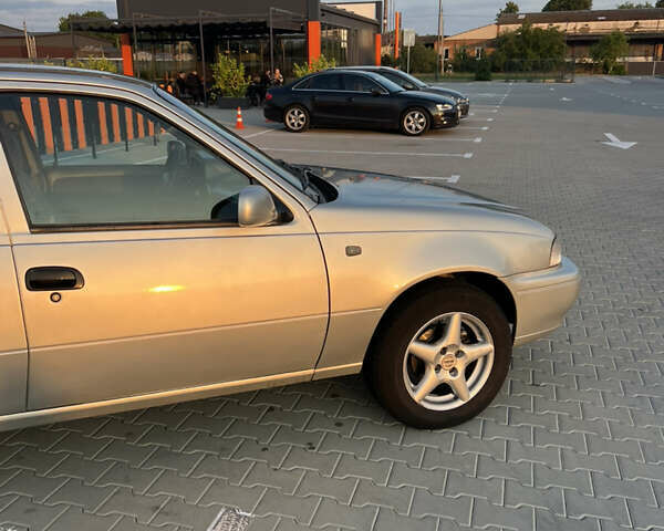 Сірий Деу Нексія, об'ємом двигуна 1.5 л та пробігом 300 тис. км за 1850 $, фото 5 на Automoto.ua