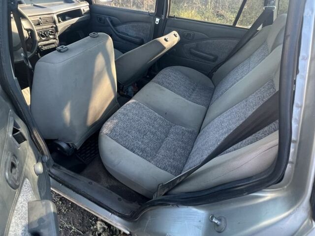 Сірий Деу Нексія, об'ємом двигуна 1.5 л та пробігом 77 тис. км за 566 $, фото 2 на Automoto.ua