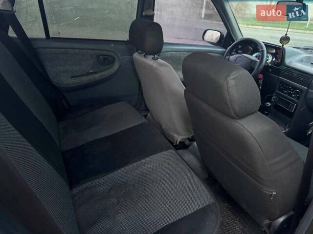 Сірий Деу Нексія, об'ємом двигуна 1.6 л та пробігом 249 тис. км за 1350 $, фото 10 на Automoto.ua