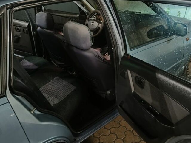 Сірий Деу Нексія, об'ємом двигуна 1.6 л та пробігом 332 тис. км за 1999 $, фото 7 на Automoto.ua