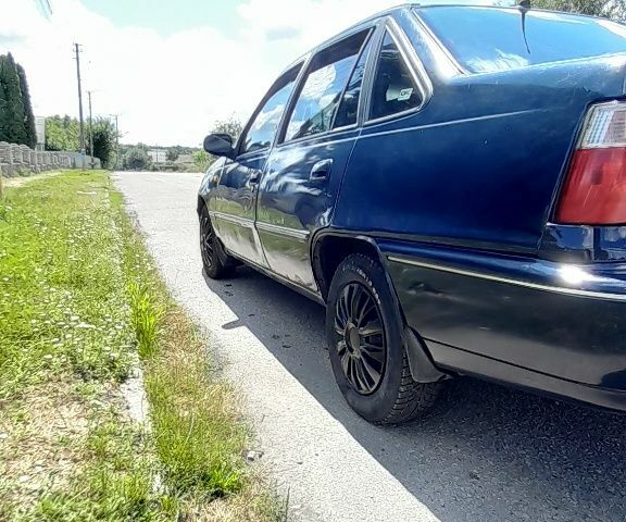 Синий Дэу Нексия, объемом двигателя 1.5 л и пробегом 335 тыс. км за 1500 $, фото 3 на Automoto.ua