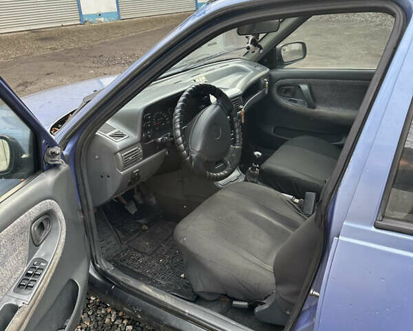 Синій Деу Нексія, об'ємом двигуна 1.5 л та пробігом 295 тис. км за 1000 $, фото 5 на Automoto.ua