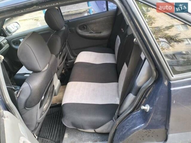 Синій Деу Нексія, об'ємом двигуна 1.5 л та пробігом 250 тис. км за 1301 $, фото 5 на Automoto.ua