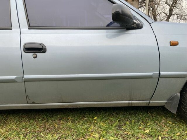 Синій Деу Нексія, об'ємом двигуна 1.6 л та пробігом 204 тис. км за 1350 $, фото 9 на Automoto.ua