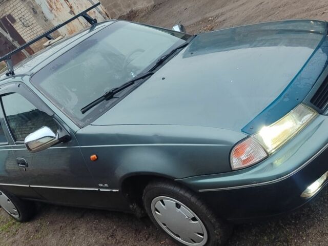 Зелений Деу Нексія, об'ємом двигуна 1 л та пробігом 350 тис. км за 854 $, фото 1 на Automoto.ua