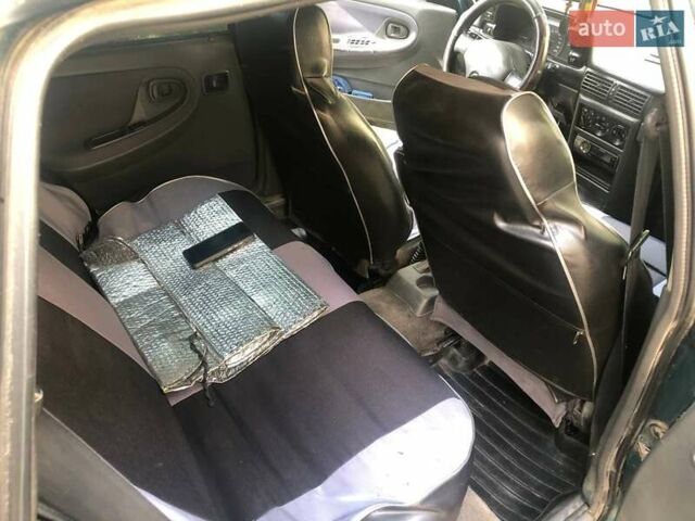 Зеленый Дэу Нексия, объемом двигателя 1.5 л и пробегом 252 тыс. км за 1300 $, фото 5 на Automoto.ua