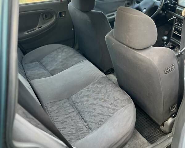 Зелений Деу Нексія, об'ємом двигуна 1.5 л та пробігом 200 тис. км за 899 $, фото 6 на Automoto.ua