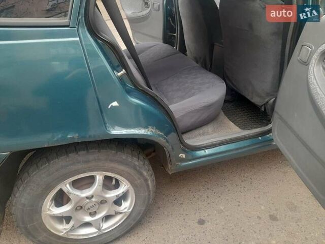 Зелений Деу Нексія, об'ємом двигуна 1.5 л та пробігом 258 тис. км за 2100 $, фото 1 на Automoto.ua