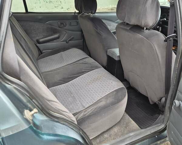 Дэу Нексия 2005 в Киеве на Automoto.ua Зеленый Дэу Нексия, объемом двигателя 1.5 л и пробегом 294 тыс. км за 1500 $, фото 9 на Automoto.ua
