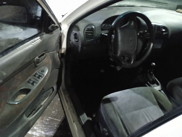 Белый Дэу Нубира, объемом двигателя 1.6 л и пробегом 235 тыс. км за 650 $, фото 4 на Automoto.ua